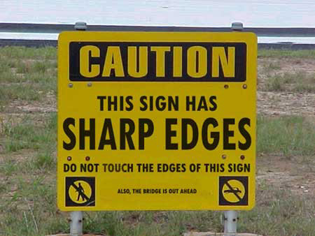 Caution sharp edges sign